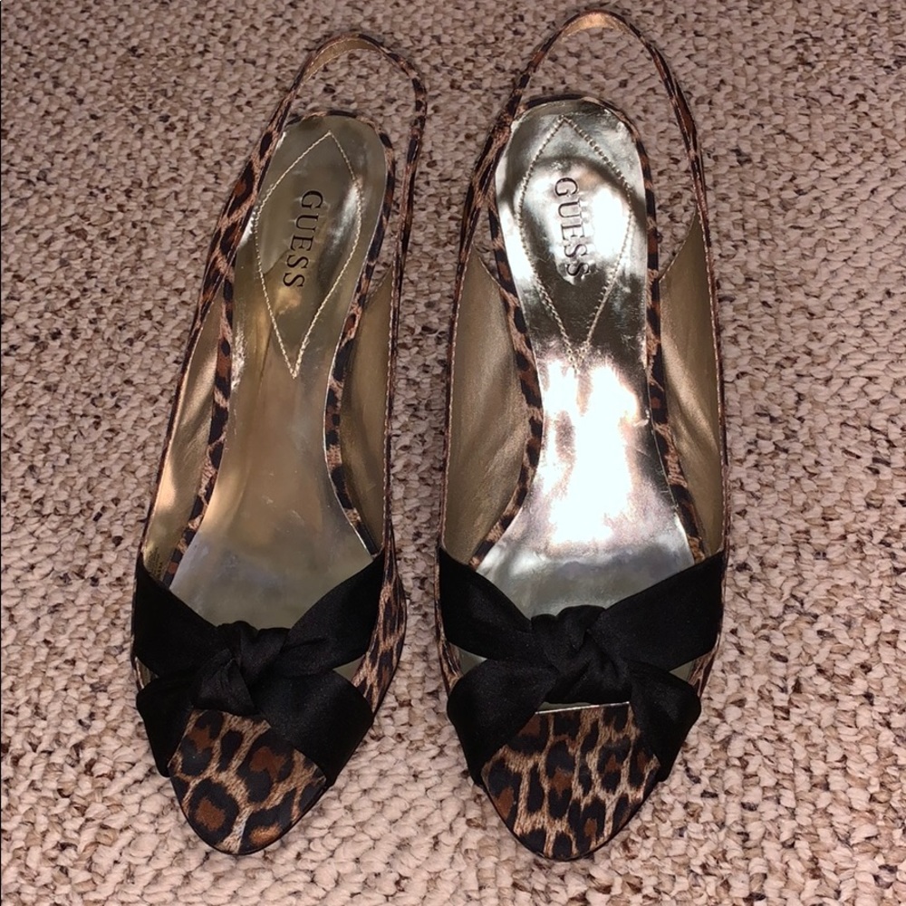 Cheetah printed heels with black bow size 8.5